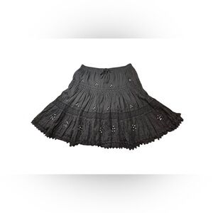 Vintage black mini skirt with laced edges, small jewels, and embroidery